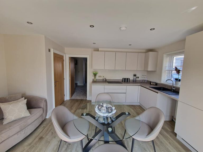 Open-plan kitchen diner with neutral painted walls