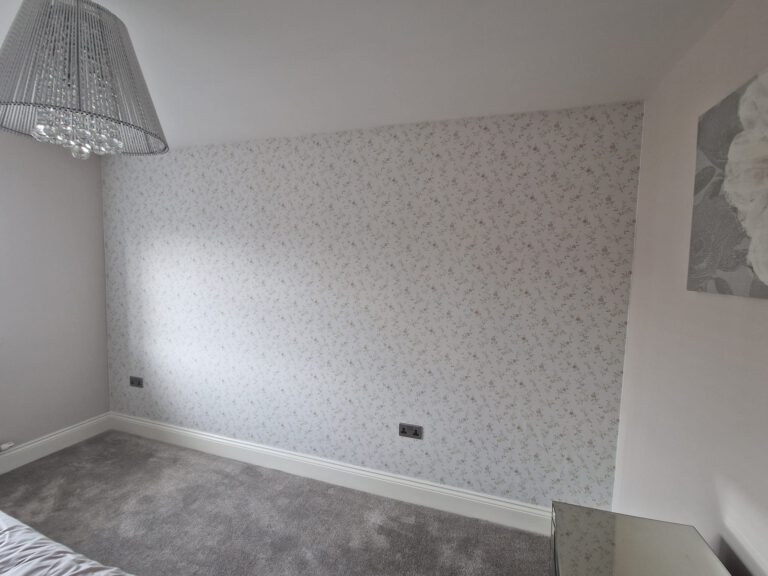 Grey leaf-pattern wallpaper feature wall