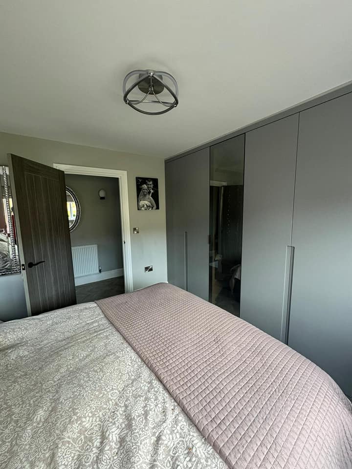 Grey bedroom with fitted wardrobes
