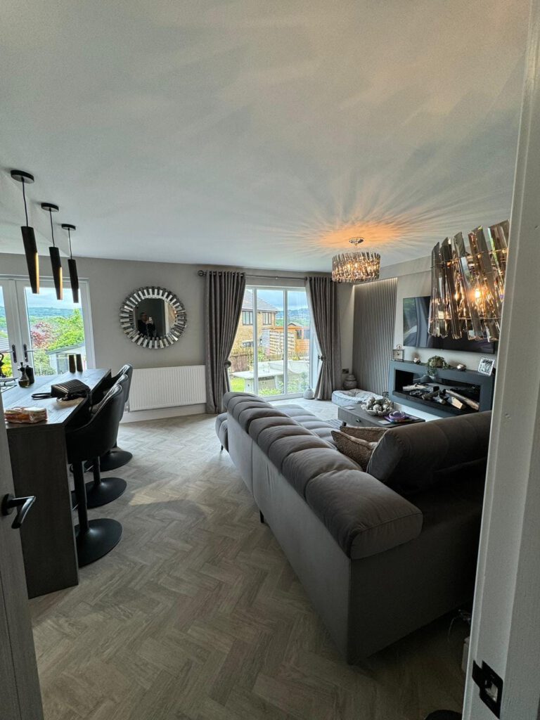 Open-plan living and dining room painted in soft grey
