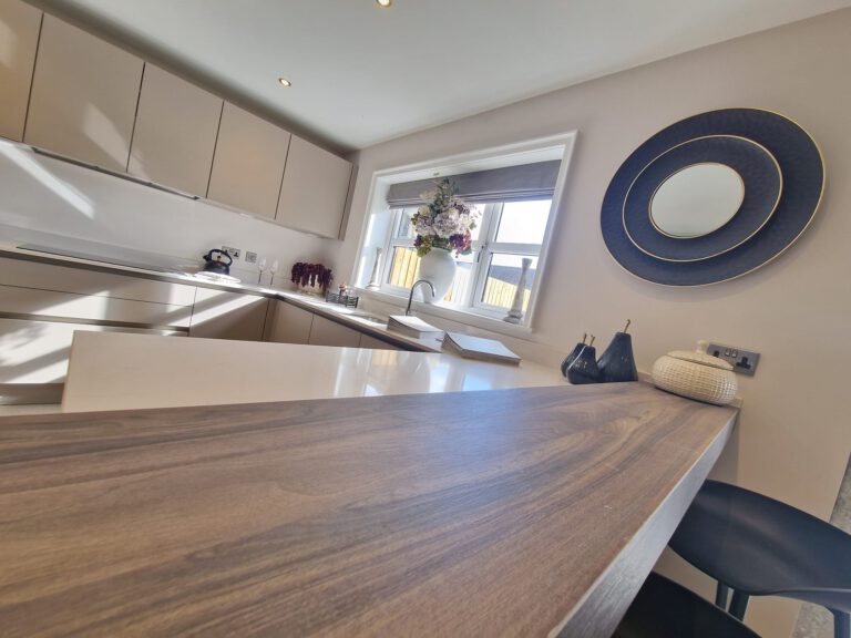 Breakfast bar in a kitchen with neutral painted walls