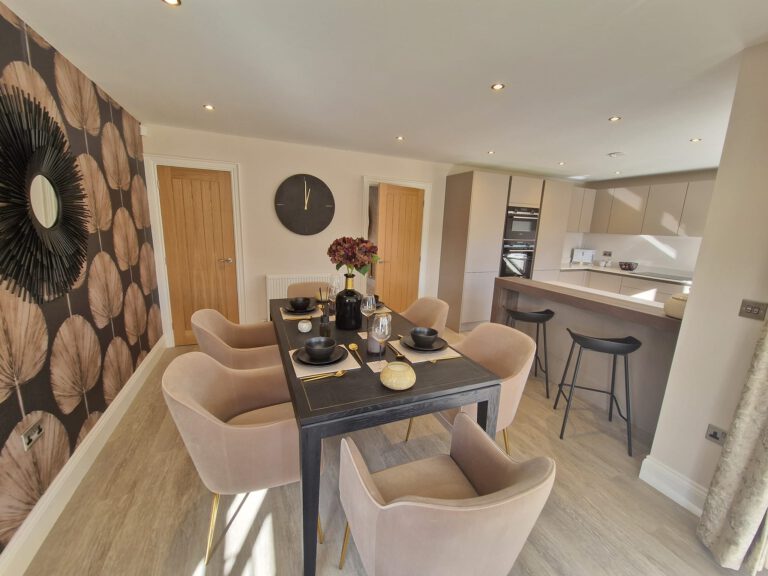 Dining area with dark fan-leaf feature wallpaper