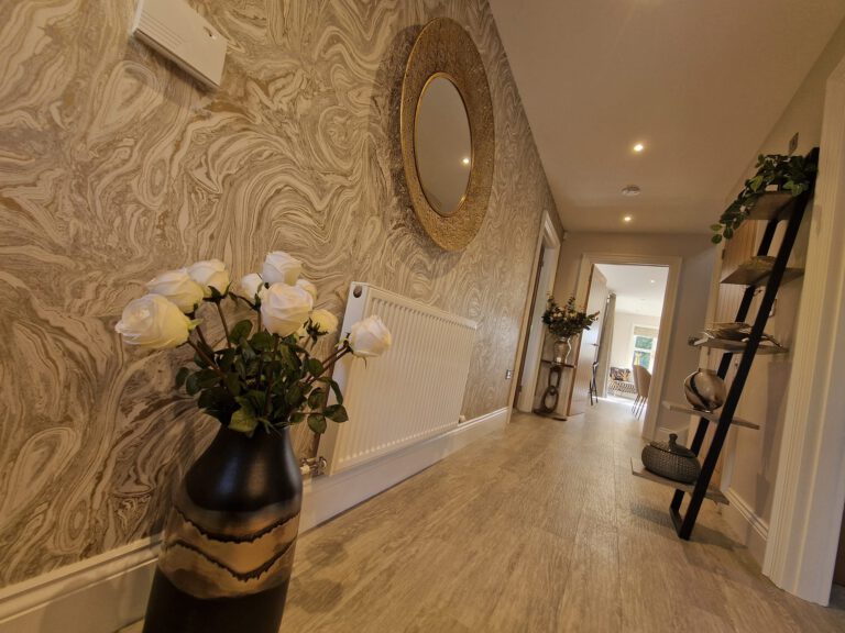 Hallway with gold swirl wallpaper