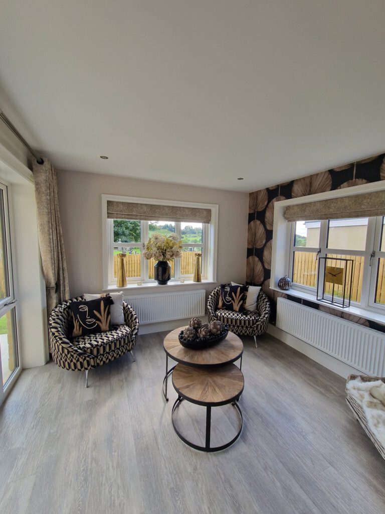 Lounge with neutral walls and a patterned feature wall
