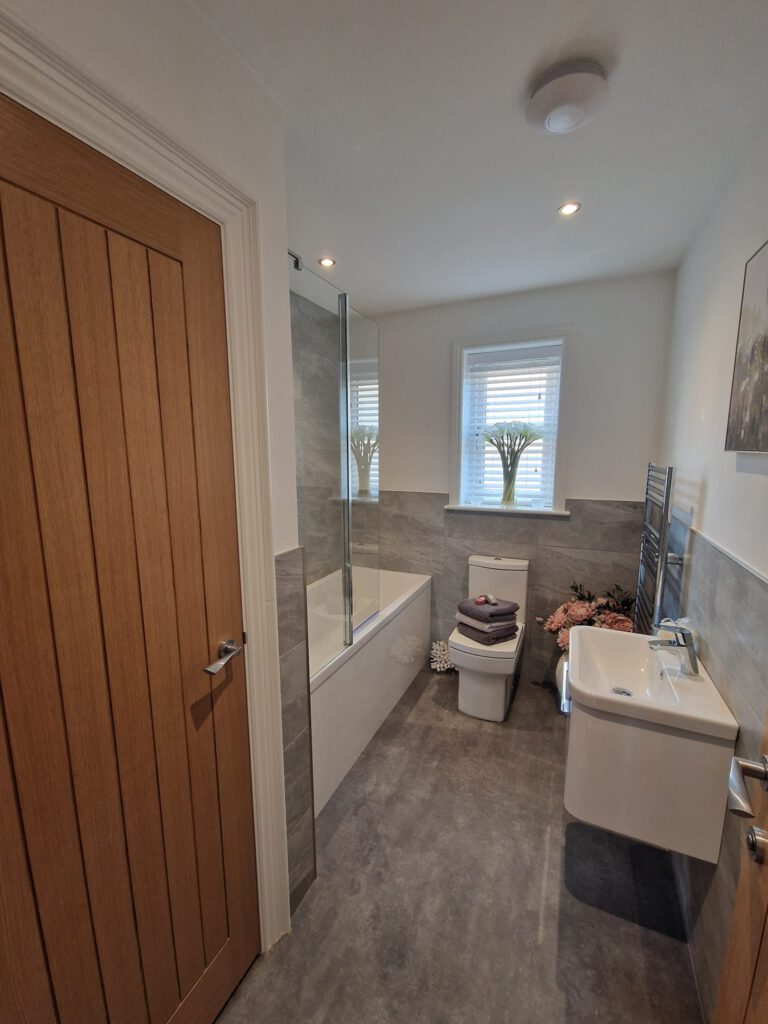 Freshly painted bathroom with an oak door
